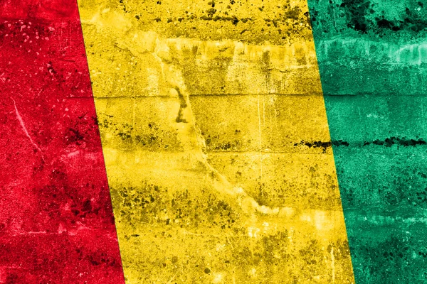 几内亚国旗 grunge 墙上绘 — 图库照片