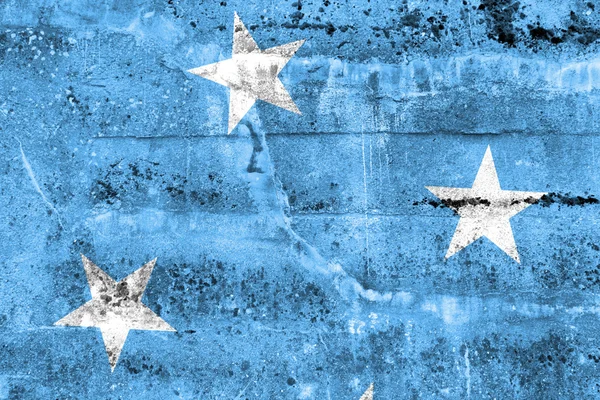 Mikronesien-Flagge an Grunge-Wand gemalt — Stockfoto