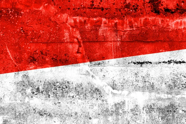 Флаг Монако, нарисованный на гранж-стене — стоковое фото