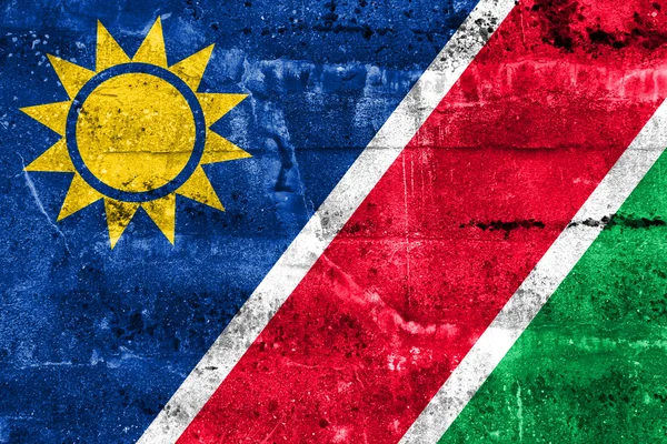 Namibia-Flagge auf Grunge-Wand gemalt — Stockfoto