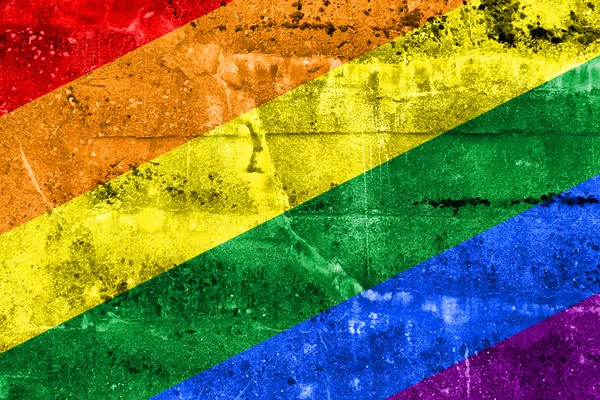 Bandeira do arco-íris pintada na parede grunge — Fotografia de Stock