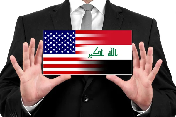 Businessman holding a business card with USA and Iraq Flag — Stock Photo, Image