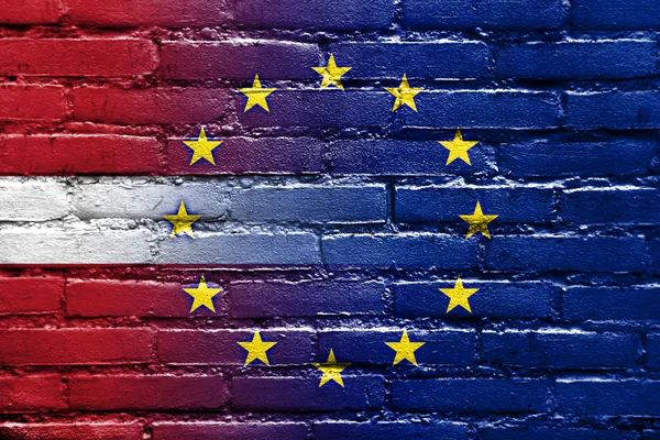 Latvia and European Union Flag painted on brick wall — Stock Photo, Image