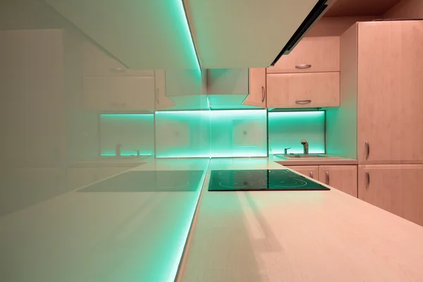 Modern luxury kitchen with green LED lighting