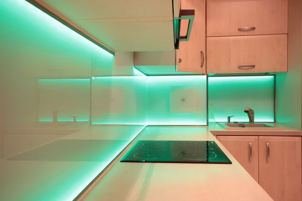 Modern luxury kitchen with green LED lighting — Stock Photo, Image