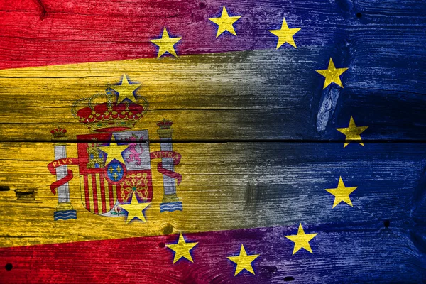 Spanien och Europeiska unionens flagga målade på gamla trä planka konsistens — Stockfoto