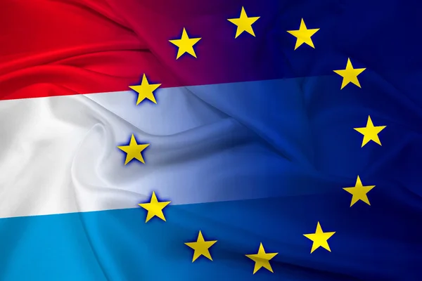 Acenando com a bandeira do Luxemburgo e da União Europeia — Fotografia de Stock