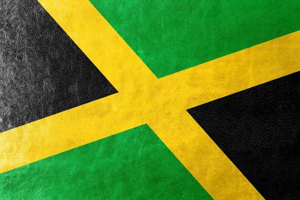 Jamaica flaggan målad på läder texture — Stockfoto