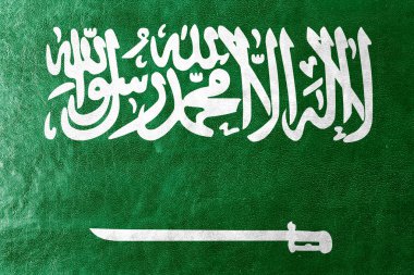 deri dokusu üzerinde boyalı Suudi Arabistan bayrağı