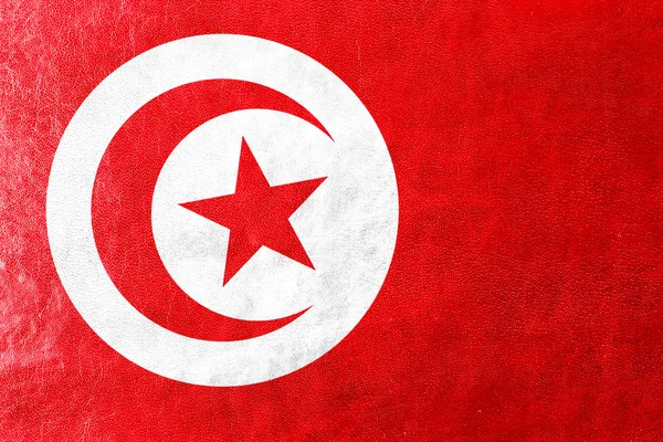 Tunisien flaggan målad på läder texture — Stockfoto