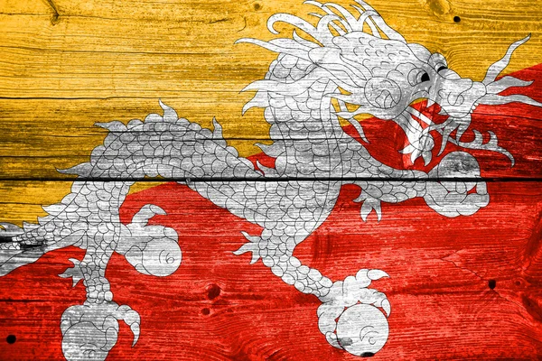 Bandera de Bután pintada sobre madera vieja textura de tablón —  Fotos de Stock