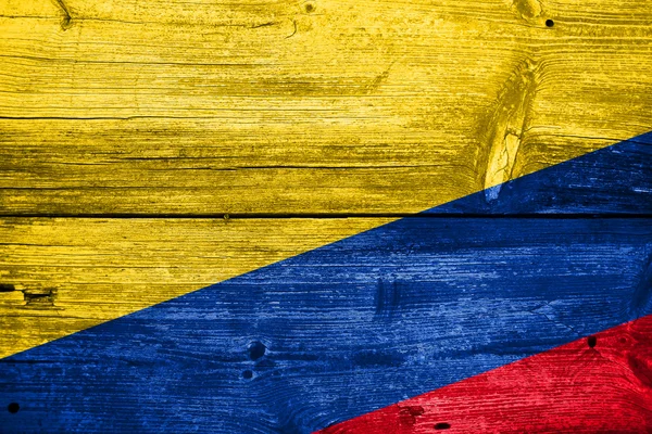 Eski ahşap tahta zemin üzerine boyalı Kolombiya bayrağı — Stok fotoğraf