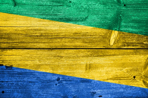 Gabon Drapeau peint sur un vieux fond de planche de bois — Photo