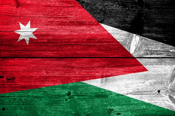 Vlajka Jordánska na staré dřevěné prkenné textury — Stock fotografie