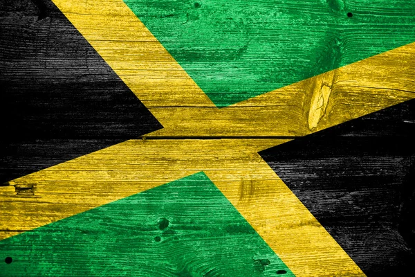 Jamaica flaggan målad på gamla trä planka konsistens — Stockfoto