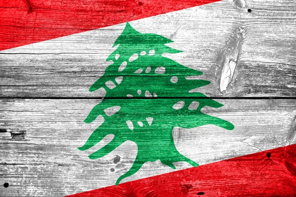 Vlajka Libanonu na staré dřevěné prkenné textury — Stock fotografie