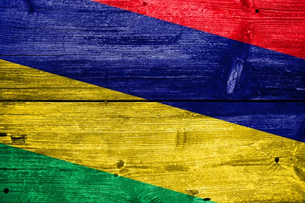 Vlajka Mauricia na staré dřevěné prkenné pozadí — Stock fotografie