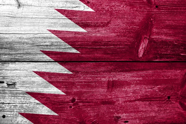 Katarská vlajka na staré dřevěné prkenné textury — Stock fotografie