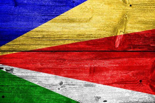 Seychellen vlag geschilderd op oude houten plank textuur — Stockfoto