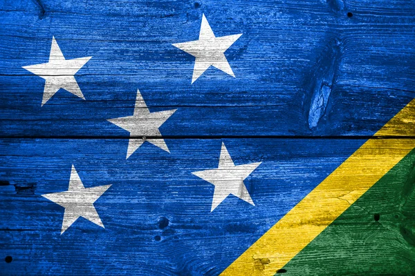 Solomon Islands Flagge auf alten Holzplanken bemalt — Stockfoto