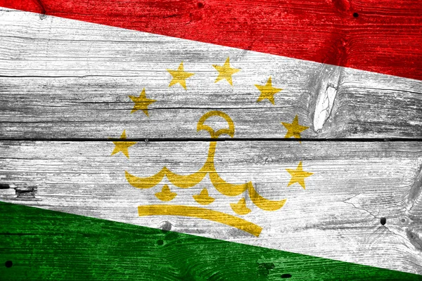 Tajikistan Flag painted on old wood plank texture — Stock Photo, Image