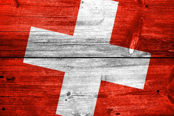 Schweiz flagga målade på gammal trä planka bakgrund — Stockfoto