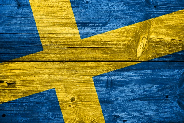 Sweden Flag painted on old wood plank background — Stock Photo, Image