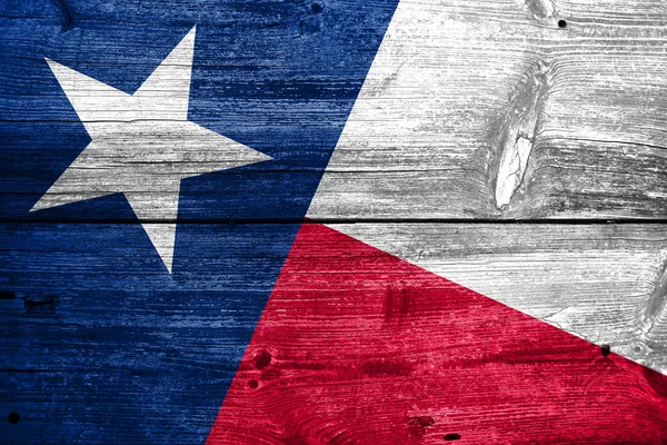 오래 된 나무 판자의 텍스처에 그려진 텍사스 주 깃발 — 스톡 사진
