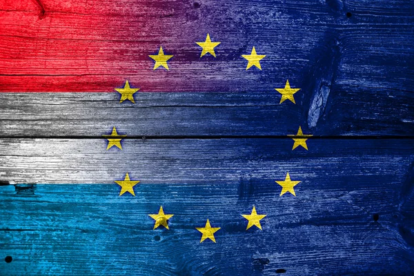 Luxembourg and European Union Flag painted on old wood plank texture — Stock Photo, Image