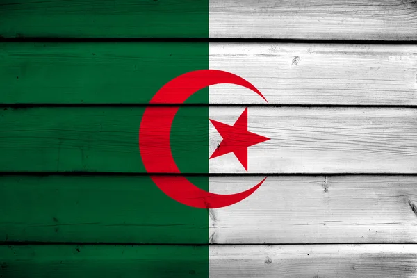 Cezayir bayrağı ahşap zemin üzerinde — Stok fotoğraf