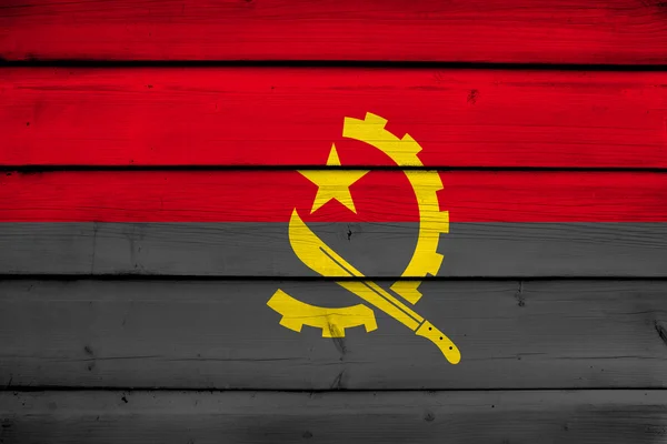 Angola Flagge auf Holz Hintergrund — Stockfoto