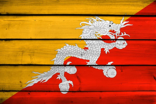 Bandiera del Bhutan su fondo legno — Foto Stock