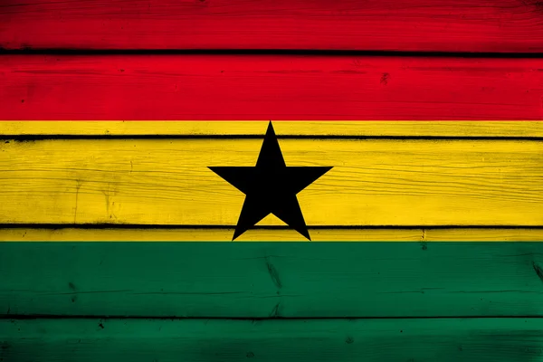 Ghana Bandera sobre fondo de madera — Foto de Stock