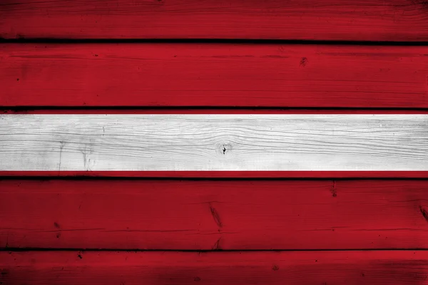 Lettonia Bandiera su fondo legno — Foto Stock