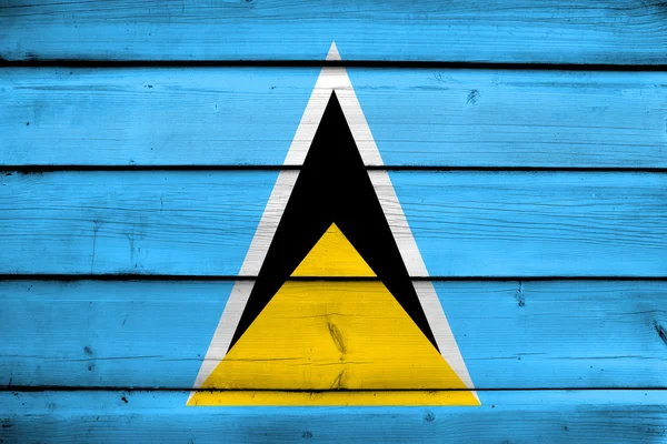 Saint Lucias flagga på trä bakgrund — Stockfoto