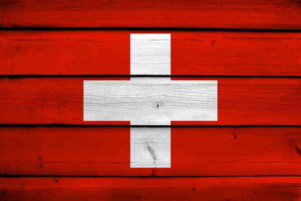 Suiza Bandera sobre fondo de madera — Foto de Stock