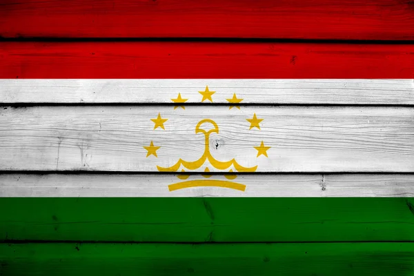 Flaga Tadżykistanu na tle drewna — Zdjęcie stockowe