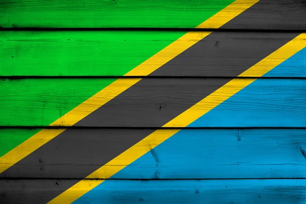 Bandera de Tanzania sobre fondo de madera — Foto de Stock