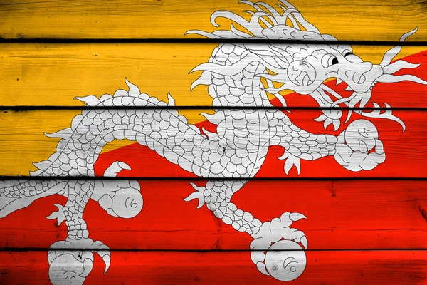 Bandiera del Bhutan su fondo legno — Foto Stock