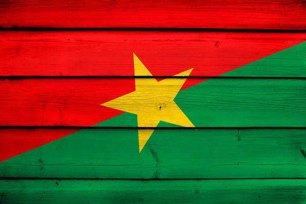 Burkina faso vlag op hout achtergrond — Stockfoto