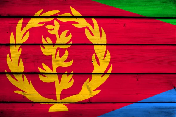 Eritre bayrak ahşap zemin üzerinde — Stok fotoğraf