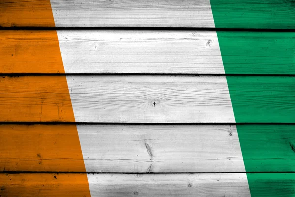 Ivory Coast Flag on wood background — Stock Photo, Image