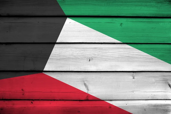 Kuwait Flagge auf Holz Hintergrund — Stockfoto