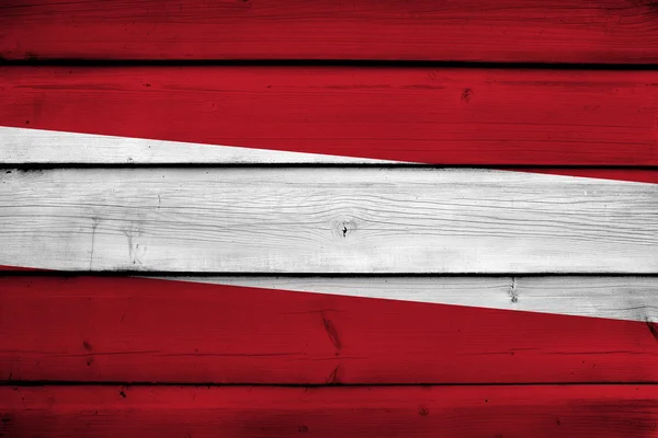 Letonia Bandera sobre fondo de madera —  Fotos de Stock