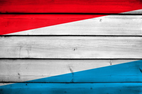 Luxembourg Flag on wood background — Stock Photo, Image