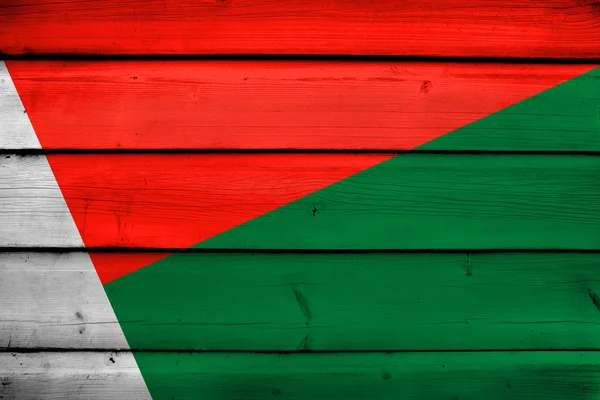 Madagascar Bandera sobre fondo de madera — Foto de Stock