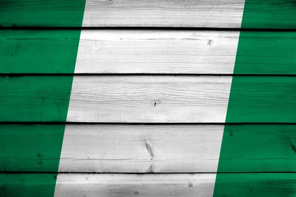 Nigéria Bandeira sobre fundo de madeira — Fotografia de Stock