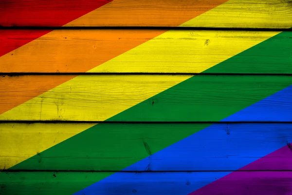 Bandiera arcobaleno su fondo legno — Foto Stock