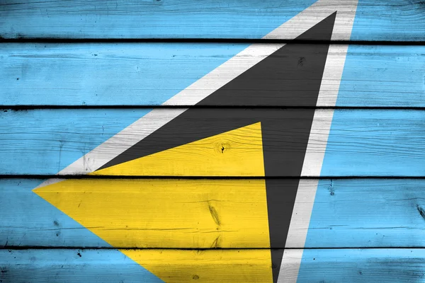 Saint Lucias flagga på trä bakgrund — Stockfoto
