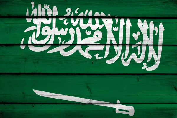 木製の背景にサウジアラビアの国旗 — ストック写真